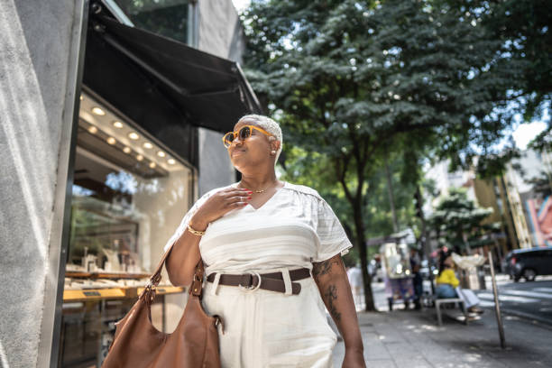 Mature woman shopping and walking in the city